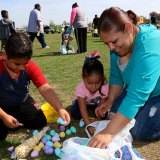 Bernice Juarez and her two children, Nayome and Miguel search their haul at Saturday's Kings Lions Easter Egg Hunt in Stratford.